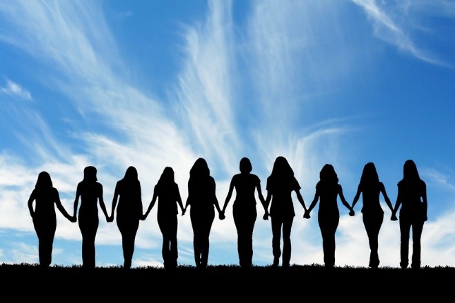 an image showing the silhouette of 10 people holding hands
