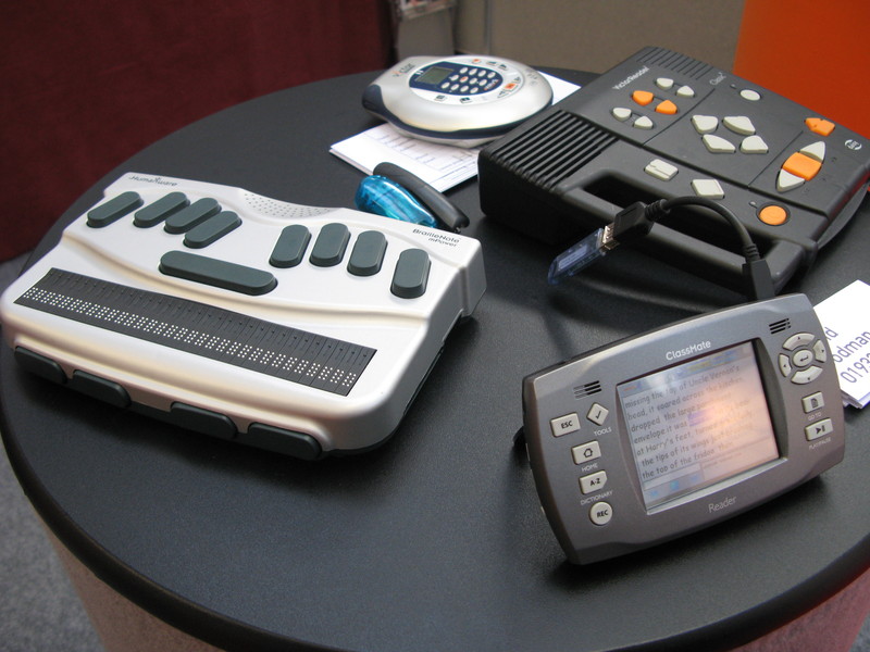 an image showing various items for communication- braille labeller, and text to speech reader. 